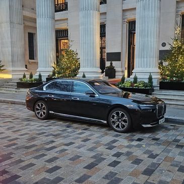 Black BMW i7 outside a grand venue — Primex Chauffeurs