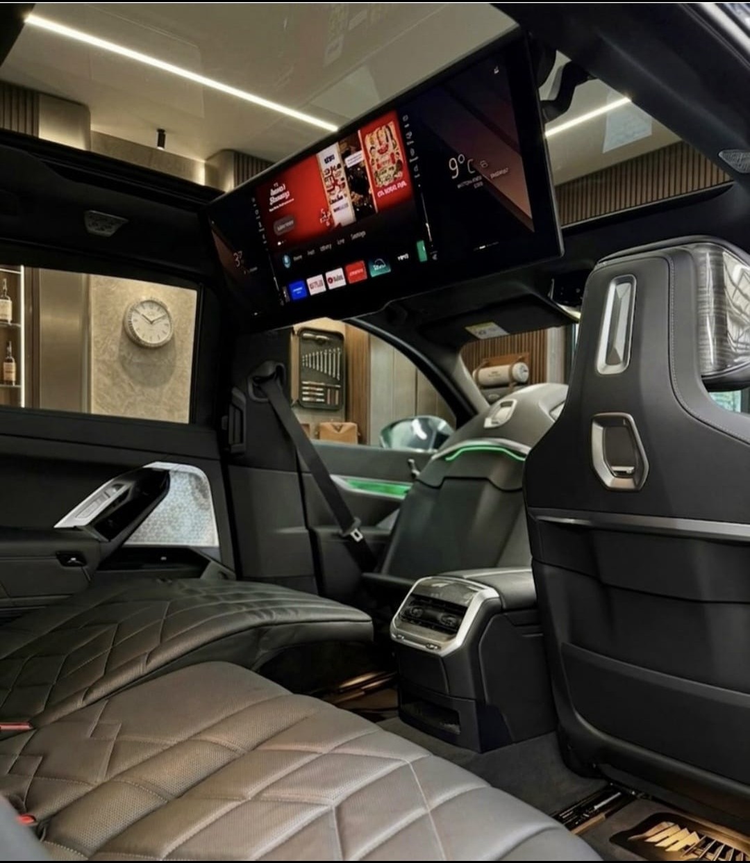 BMW i7 cabin — the 31-inch BMW Theatre Screen deployed