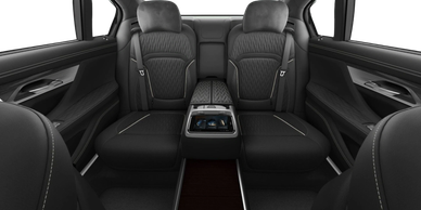 Mercedes-Benz V-Class VIP cabin — black diamond-quilted seats and privacy table, photographed by Primex Chauffeurs